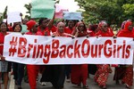 Women attend a demonstration calling on the government to rescue the kidnapped schoolgirls of the Chibok secondary school, in Abuja, Nigeria, Tuesday, May 13, 2014.