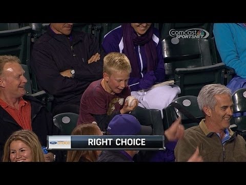 A young fan can't believe he has a foul ball