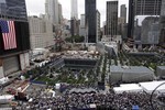 Friends and family members of 9/11 victims visit a September 11 Memorial waterfall during a ceremony marking the 10th anniversary of the attacks, Sunday, Sept. 11, 2011 in New York.