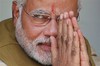 Opposition Bharatiya Janata Party (BJP) leader and India's next prime minister Narendra Modi greets the gathering at the home of his 90-year-old mother in Gandhinagar, in the western Indian state of Gujarat, Friday, May 16, 2014.