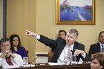 Rep. Rob Woodall, R-Ga., joined at left by Rep. Tom Cole, R-Okla., responds to statements by Democrats on the House Rules Committee about political motivations as lawmakers work on the creation of a special select committee to investigate the attack on the U.S. diplomatic outpost in Benghazi, Libya, that killed the ambassador and three other Americans, at the Capitol in Washington, Wednesday, May 7, 2014.