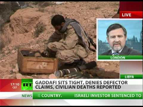 Libya Conflict: Gaddafi sits tight, denies defector claims