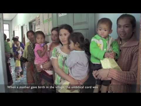 Health workers helping mums in Laos