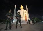 Thai soldiers stand guard in front of the Democracy Monument after the coup Thursday, May 22, 2014 in Bangkok, Thailand.