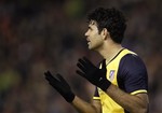 Atletico de Madrid's Diego Costa reacts after failing to score against Valencia during their la Copa del Rey soccer match at the Mestalla stadium in Valencia, Spain, Tuesday, Jan. 7, 2014