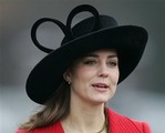  Kate Middleton, a friend of Britain&acute;s Prince William wears a hat with a giant heart, as she arrives at the Royal Military Academy, Sandhurst, where graduates, including the Prince, took part in the Sovereign&acute;s parade at the academy, near Camb