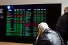 AFR photo Tamara Voninski.  Investors view the ASX stock board on Bridge Street in Sydney. generic stock exchange ASX  investor shares portfolio