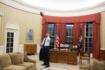 President Barack Obama tosses a football in the Oval Office, Jan. 6, 2014.