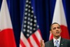 U.S. President Barack Obama gestures as he delivers a speech at a hall in Tokyo Saturday, Nov. 14, 2009. Obama said in the speech that he welcomes a robust China on the world scene, but he cautioned that all nations must respect human rights, including religious freedoms.