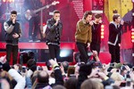 One Direction members, from left, Niall Horan, Zayn Malik, Harry Styles, Louis Tomlinson and Liam Payne perform on ABC's "Good Morning America" on Tuesday, Nov. 26, 2013 in New York.