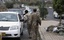 Yemeni soldiers stop cars at a checkpoint in a street in Sanaa, Yemen, Monday, May 12, 2014.