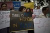 Members of Pakistan's civil society hold banners during a protest to condemn the killing of pregnant woman Farzana Parveen