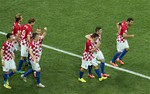 Croatia players celebrate after Brazil's Marcelo scored an own goal during the group A World Cup soccer match between Brazil and Croatia, the opening game of the tournament, in the Itaquerao Stadium in Sao Paulo, Brazil, Thursday, June 12, 2014.