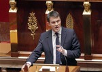 French prime minister Manuel Valls delivers a speech at the National Assembly in Paris, Tuesday, April 29, 2014. France’s parliament is due to vote on President Francois Hollande’s plan to cut 50 billion euros ($69 billion) of spending to fund lower payroll taxes.