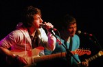  The Arctic Monkeys&acute; Alex Turner, left, and Jamie Cook perform at the SXSW Music Festival in Austin, Texas, late Friday, March 17, 2006. (AP Photo/Jack Plunkett)   (js1) 