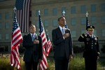 File - Defense Leon E. Panetta, President Barack Obama and Army Gen. Martin E. Dempsey, chairman of the Joint Chiefs of Staff render honors during the playing the National Anthem during ceremony  commemorating the 11th anniversary of the Sept. 11, 2001 terrorist attacks on the Pentagon, Sept. 11, 2012.