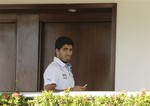 Uruguay's Luis Suarez uses his cell phone at a hotel in Natal, Brazil, Wednesday, June 25, 2014. Suarez bit Italian player Giorgio Chiellini during Uruguay's game with Italy on Tuesday, which could lead to Suarez being kicked out of the World Cup.