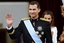 Spain's newly crowned King Felipe VI waves during a swearing-in ceremony at the Spanish parliament in Madrid, Spain, Thursday, June 19, 2014. Felipe's father Juan Carlos, who reigned during four decades, stepped down after signing an abdication law Wednesday so that younger royal blood can rally a country beset by economic problems, including an unemployment rate of 25 percent.