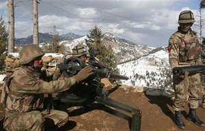 In this picture taken on March 7, 2011, Pakistan army soldiers take positions in the Pakistani tribal area of Ditta Kheil in North Waziristan where the Pakistan army are fighting against militants and al-Qaida activists along the Afghanistan border.