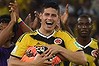 Safer on the pitch ... Colombia's outstanding midfielder James Rodriguez and his teammates celebrate after defeating Uruguay 2-0 at the Maracana Stadium in Rio de Janeiro. Multiple deaths have been reported in Columbia after raucous celebrations following World Cup victories.