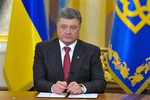 In this photo taken late Monday, June 30, 2014 Ukrainian President Petro Poroshenko makes a televised address in Kiev, Ukraine. Poroshenko said he was abandoning a unilateral cease-fire in the conflict with pro-Russian separatists and sending military forces back on the offensive after talks with Russia and European leaders failed to start a broader peace process. The cease-fire expired Monday evening.