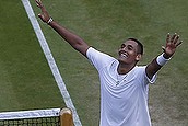 Nick Kyrgios of Australia celebrates defeating  Rafael Nadal of Spain in their men's singles match on Centre Court at the All England Lawn Tennis Championships in Wimbledon, London, Tuesday, July 1, 2014. (AP Photo/Sang Tan)