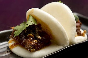 A pair of pork belly bao.