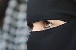 In this Friday, April 23, 2010 file photo, a 31-year-old French veiled woman, no name released, addresses the media in Nantes, western France.