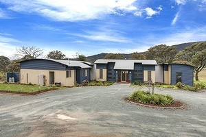 The rooflines mimic surrounding hills and the home is built in three distinct, linked modules at 198 Settlers Road, Royalla.