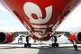 A security officer (R) stands by AirAsia aircraft.