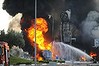 Firefighters in the southern Israeli city of Ashdod extinguish a blaze at a petrol station hit by a rocket fired from the Gaza Strip.