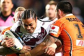 Steve Matai of the Sea Eagles is tackled by Dene Halatau and Blake Austin of the Tigers during the round 18 NRL match between the Manly-Warringah Sea Eagles and the Wests Tigers