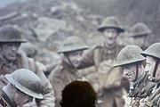 A child looks at a projected stills image of WWI soldiers. The First World War Galleries tell the story of the war and feature over 1,300 objects from diaries and personal mementos through to weapons, posters and film. 