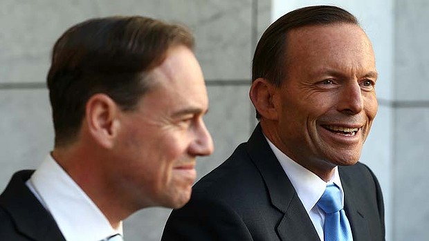 Prime Minister Tony Abbott and Environment Minister Greg Hunt address the media after the carbon tax repeal bill goes through the Senate on Thursday.