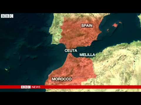 BBC News   Spanish border fence stormed by African immigrants