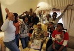 Former South Africa's President Nelson Mandela poses with his grandchildren, at his home in Qunu, South Africa, Friday, July 18, 2008.