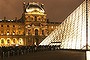 People queue outside the Louvre' pyramid in Paris, during the first 