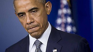 U.S. President Barack Obama pauses while speaking in the Brady Press Briefing Room at the White House in Washington, D.C., U.S., on Friday, July 18, 2014. 
