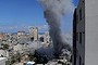 Smoke rises behind a mosque's minarets after an Israeli missile strike in Gaza City.