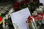 Flowers and message of condolence are left outside the Dutch embassy in Moscow.