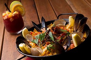 Paella and a glass of sangria at The Sangria Bar at Ole.