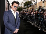 Johnny Depp arrives at the Los Angeles premiere of "Transcendence" at the Westwood Regency Village Theater on Thursday, April 10, 2014.