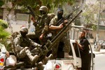 A Palestinian militants of the Ezzedine al-Qassam Brigades, Hamas's armed wing, parade in Rafah, southern Gaza Strip, on May 29, 2014. Palestinian president Mahmud Abbas sent a "letter of designation" to Rami Hamdallah, who is currently serving as premier within the West Bank-based government, to head a unity government but announcement of the lineup was held up over the foreign affairs portfolio. Hamas and the Western-backed PLO, which is dominated by Abbas's secular Fatah party, signed a surprise reconciliation agreement on April 23 to end years of bitter and sometime bloody rivalry. Photo by Ahmed Deeb / WN