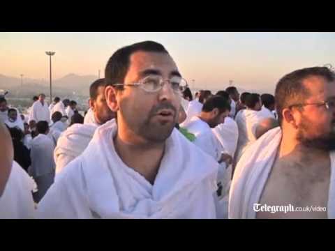 Muslim hajj pilgrims scale Mount Arafat near Mecca