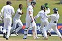 Sri Lankan bowler Dilruwan Perera (third from left) and teammates celebrate the dismissal of South Africa's Dean Elgar on the second day of the second Test in Colombo on Friday.