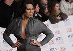 Lauren Goodger arrives for the National Television Awards at the 02 Arena in east London, Wednesday, Jan. 25, 2012.