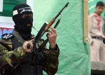  GAZA CITY, GAZA STRIP - NOVEMBER 26 : An armed Palestinian militant takes part in a pro-Hamas demonstration.  Palestinian Hamas supporters chant anti-Israeli slogans during an anti-Israel rally at the Jabalya refugee camp in the northern Gaza Strip on Fr