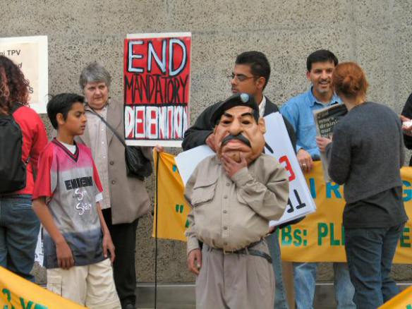 Man in Saddam Hussein mask