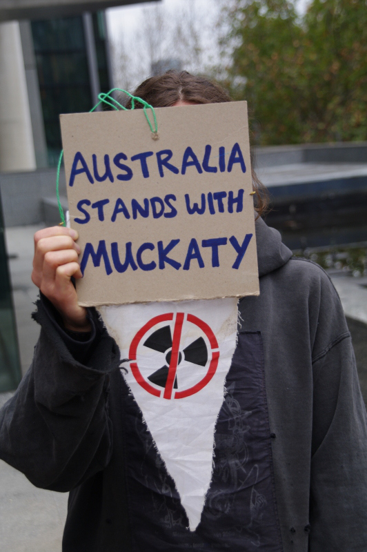 Campainger with placard - Australia stands with Muckaty