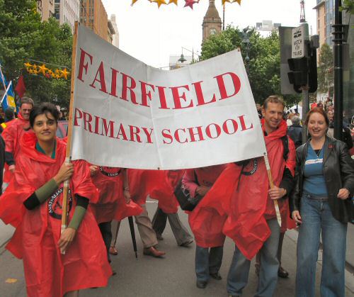 Teachers with banner of Fairfield Primary School